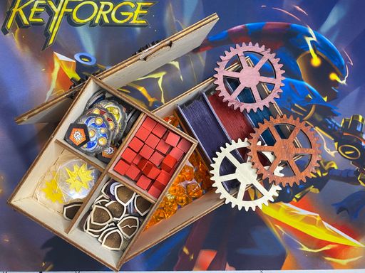 The box’s contents on a KeyForge playmat