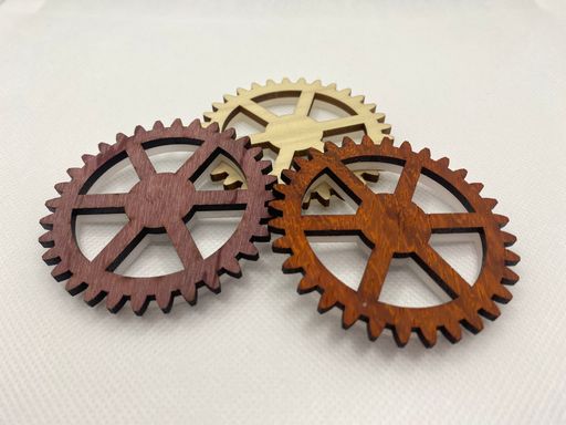 Three gears, one red, one blue, one yellow