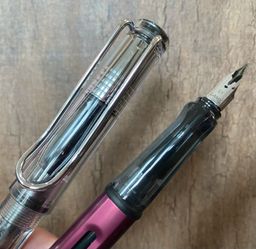 Capped clear Lamy Safari and uncapped Lamy Al-Star
