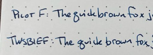 Closeup showing the TWSBI nib has less consistent ink than the Pilot